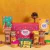 Holi Gift Box – 8 Item Gift Hamper with Gulaal, Chocolate Coated Nuts, Hazelnut Chocolate Laddoo & more